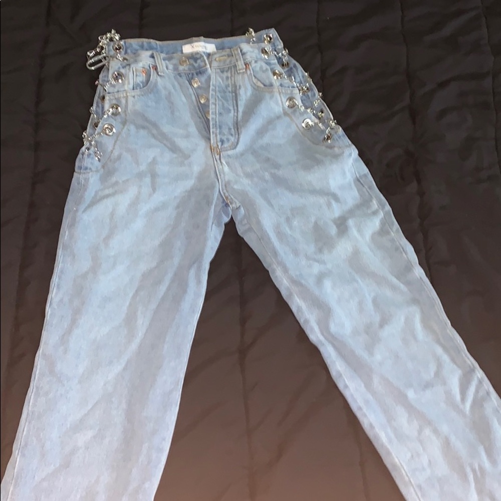 Mom jean with chains on the sides